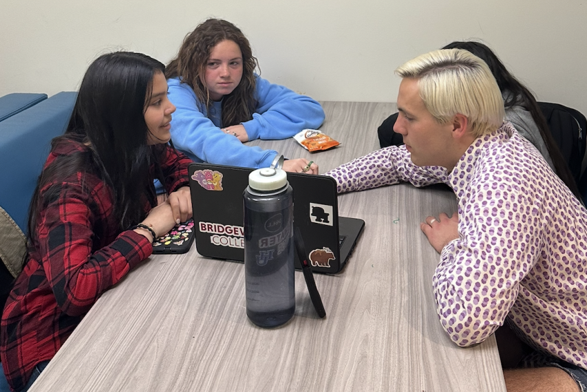 youth and instructor sitting around table