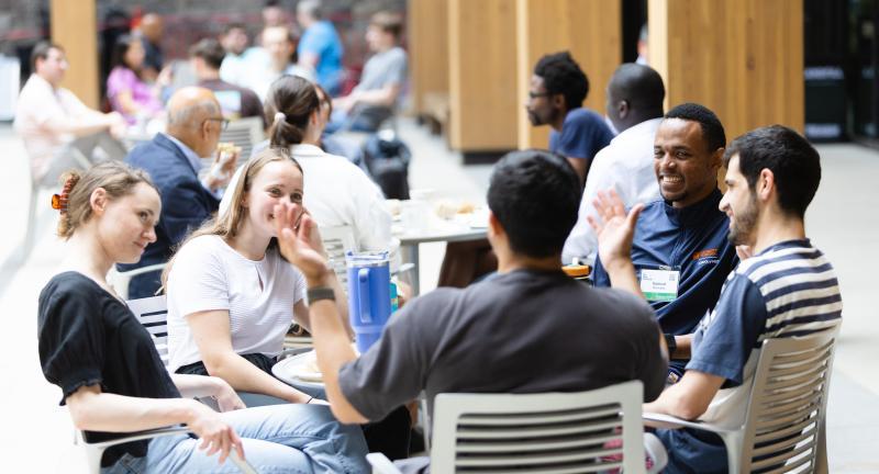 students in courtyard table at uva contemplative commons