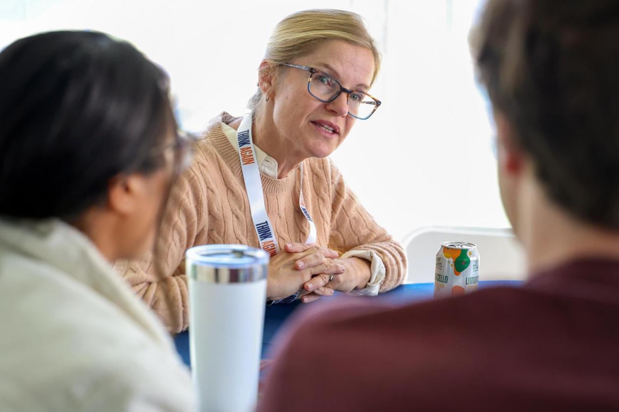 female professor with think again lanyard talking