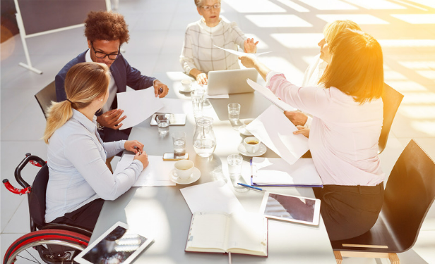 people sitting around table talking